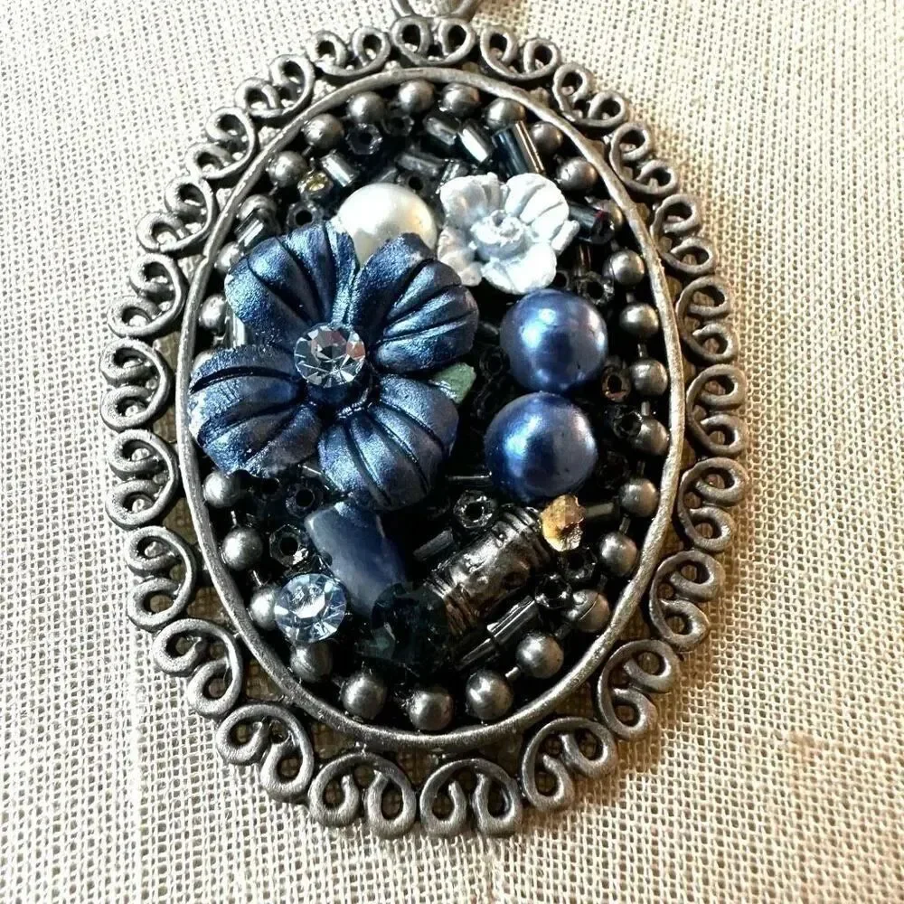 Blue floral beaded pendant necklace on multi cord